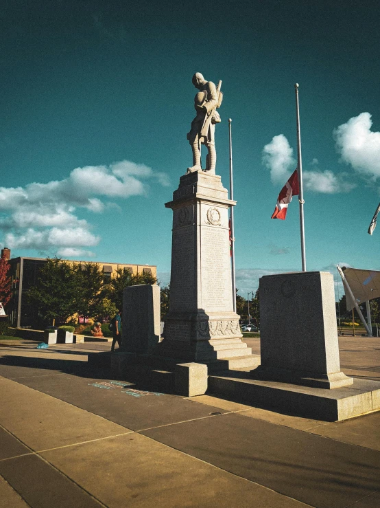 the large statue is in a city square