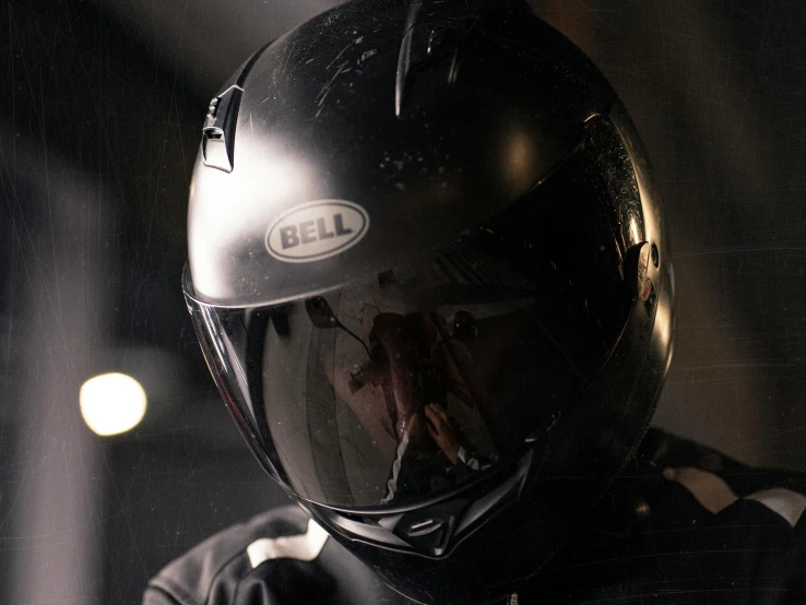 a person with a helmet wearing a black shirt