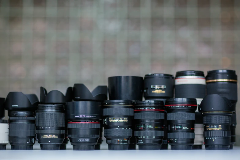 a group of camera lens set on top of each other