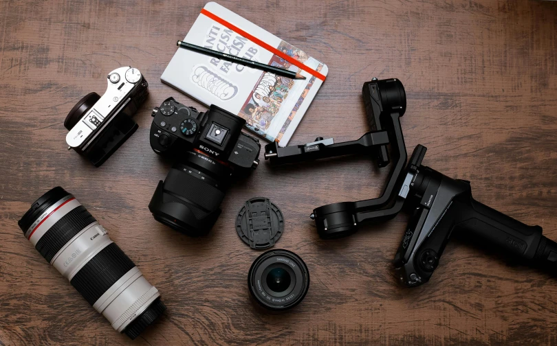 many different types of cameras on a table