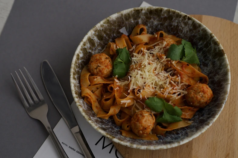 a bowl of food is on top of a table