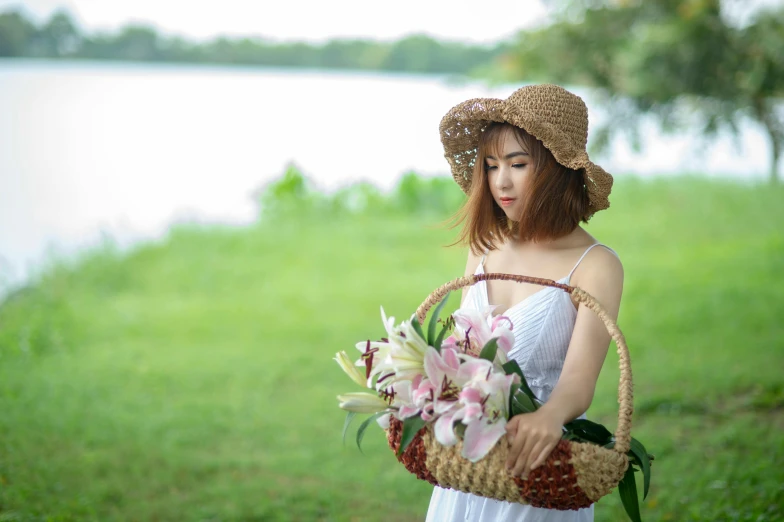 a girl with a big basket that is holding flowers