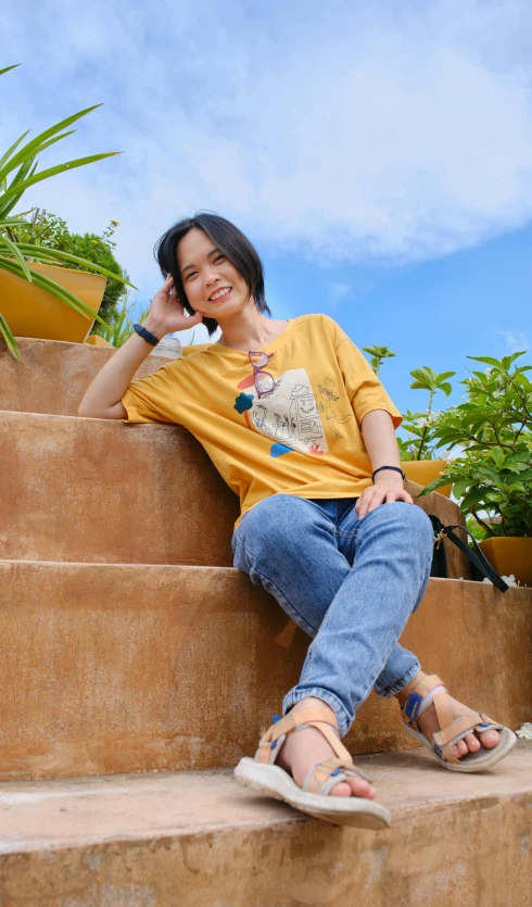 a woman with sandals sits on the steps