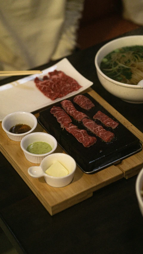 a wooden table topped with lots of food