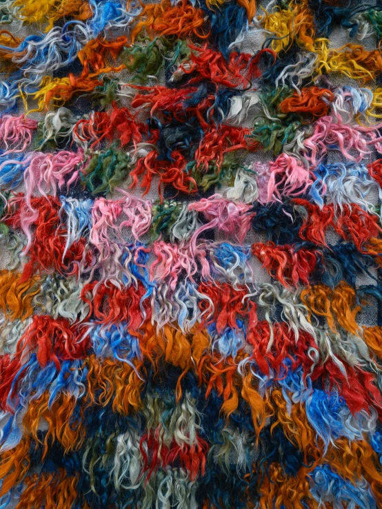 a pile of multi colored fabric lying on a table