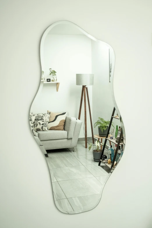 a reflection in the mirror of a living room