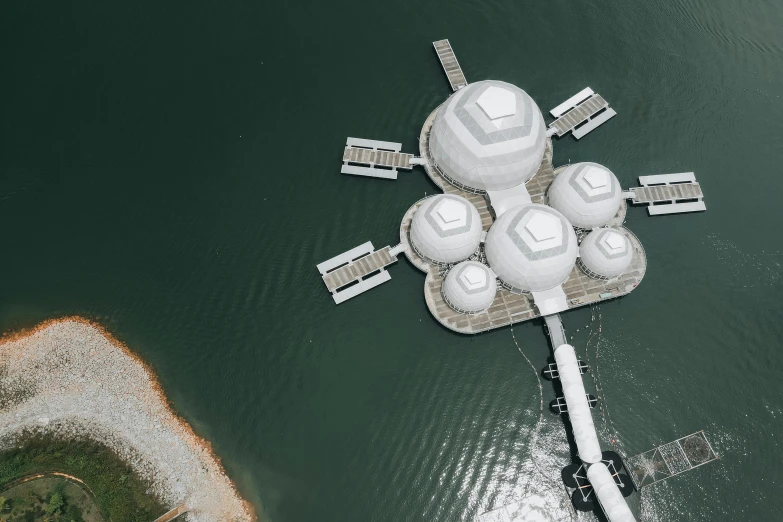 some white buildings on the edge of water