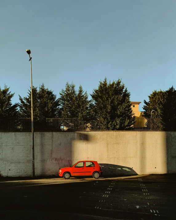 a car parked on the side of a wall