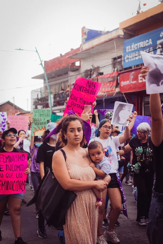 a group of people holding up signs and signs