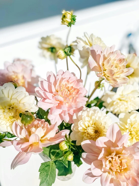 large flower arrangement in vase filled with water