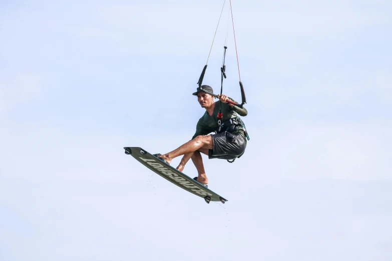 a man flying through the air while riding a wake board
