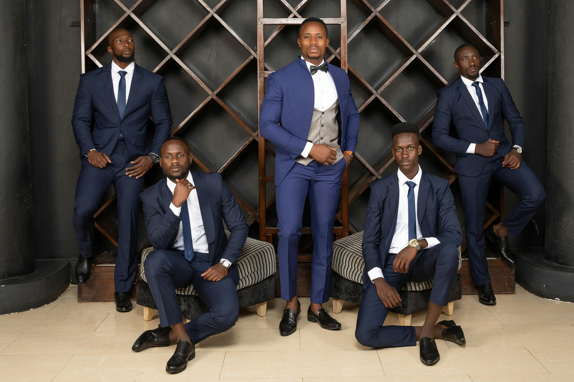 a group of men in suits posing for a pograph