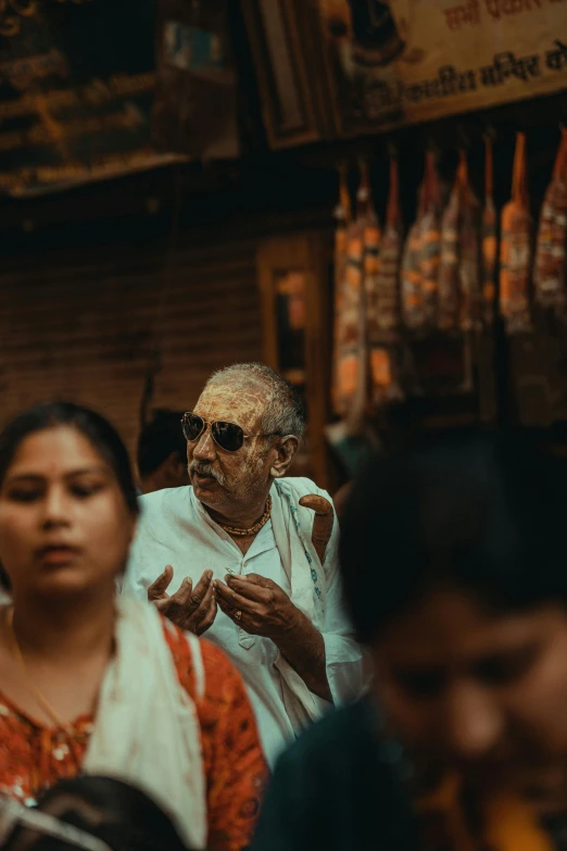 an old man and women looking at soing while walking