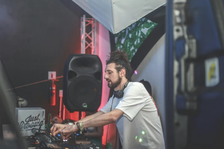 a man that is standing up using a mixer