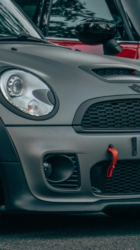 a car with a red front bumper and two different sides