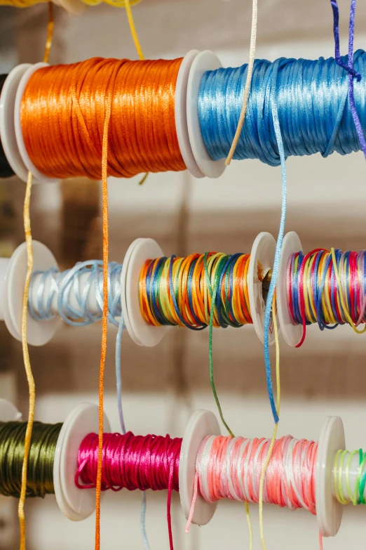 different colors of thread sitting next to each other