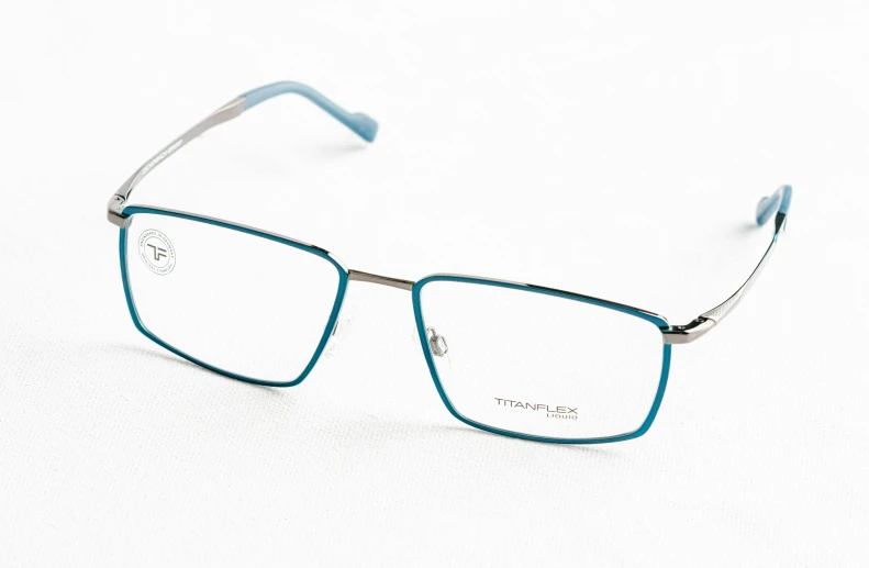 a pair of blue glasses is on a white surface