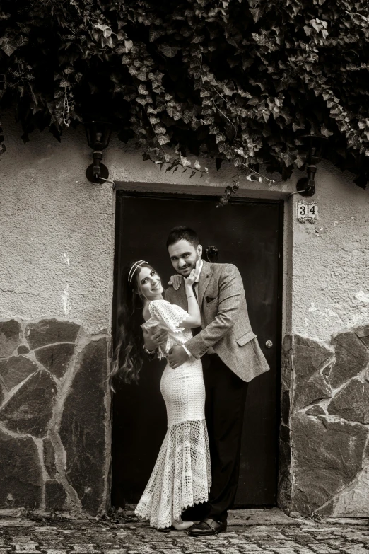 man and woman in vintage dress standing together next to each other