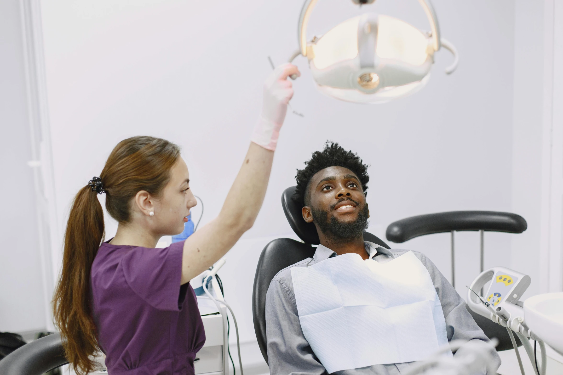 a woman giving an arm massage to a man with ces