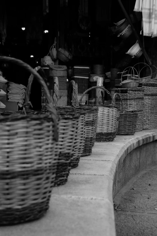 some baskets lined up in front of a pool