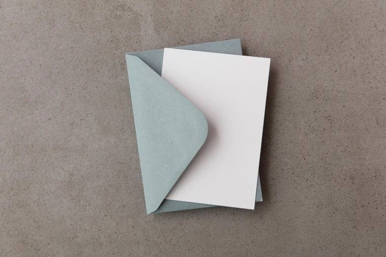 an empty paper placed on top of a sheet of gray