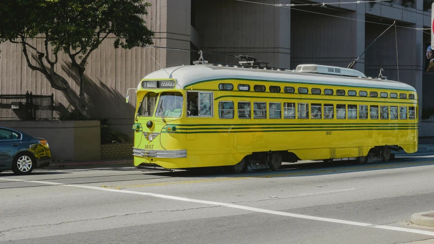 an old bus has no doors and has yellow paint