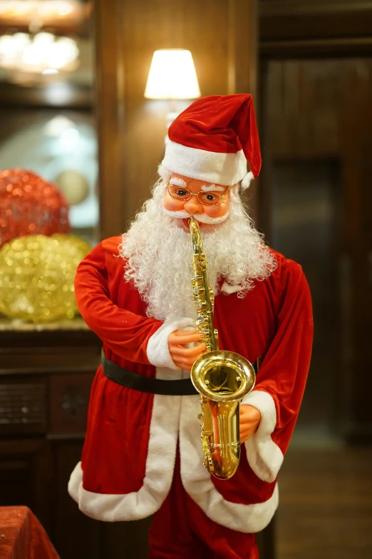 a statue of santa clause playing the saxophone