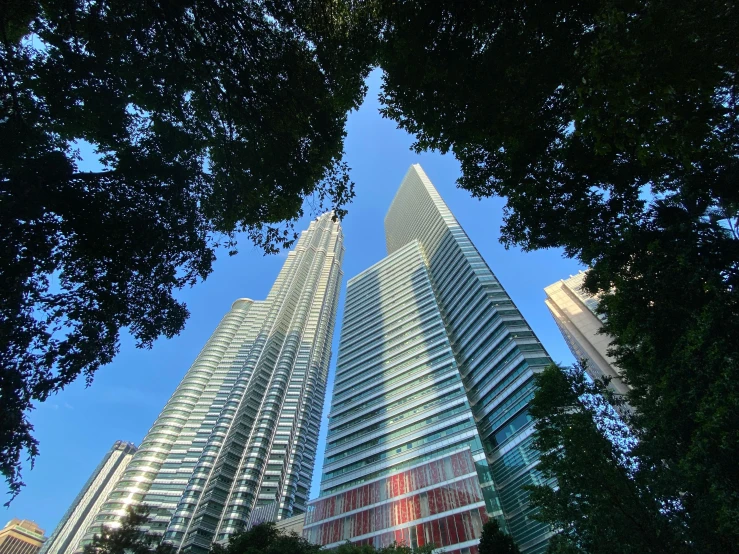 two large skyscrs towering up into the sky