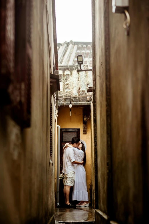 a man and woman are standing at a door