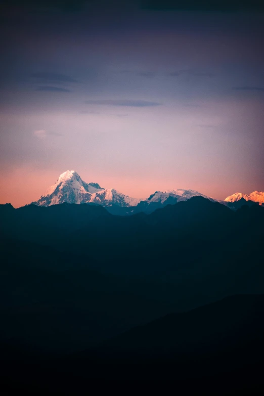 a beautiful sky showing the top of a mountain