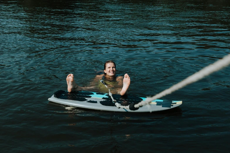 a man riding on top of a paddle board