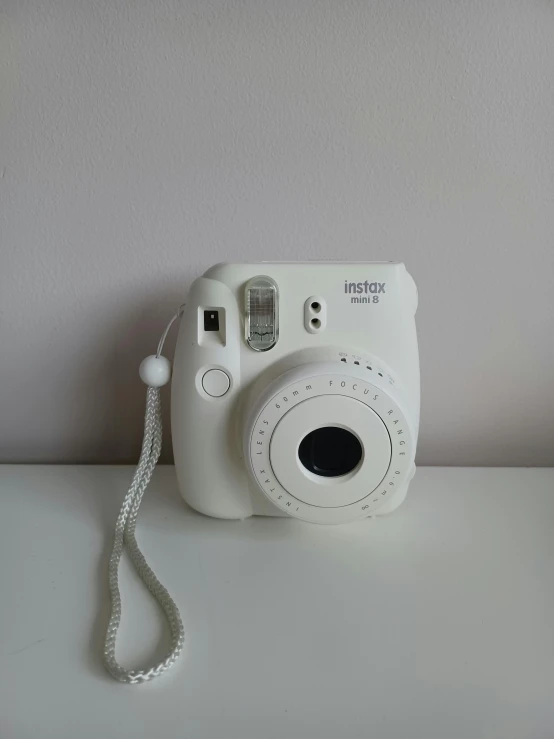 a camera with its lens pointed upwards on a counter