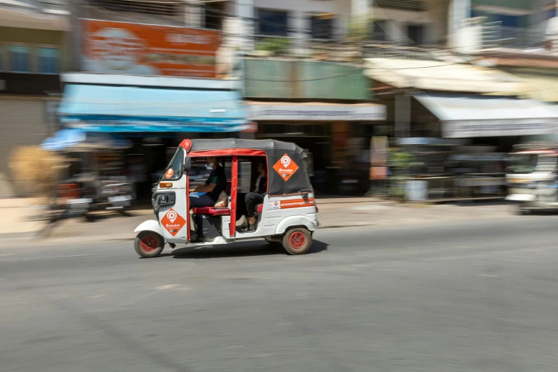 a golf cart is in the middle of the street