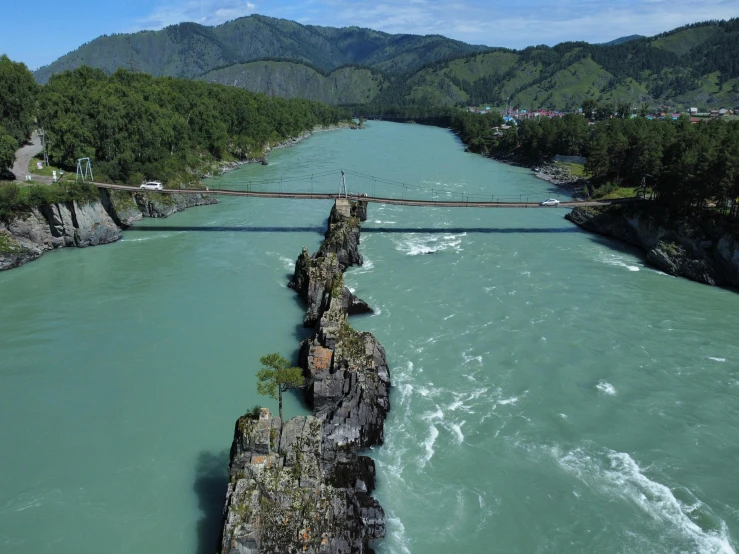 there is a bridge above the river water