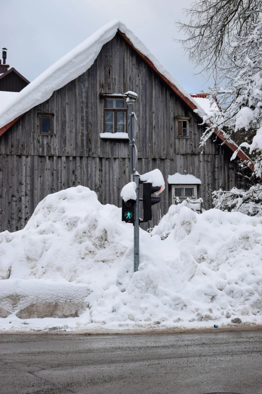 the street is blocked off by a pile of snow