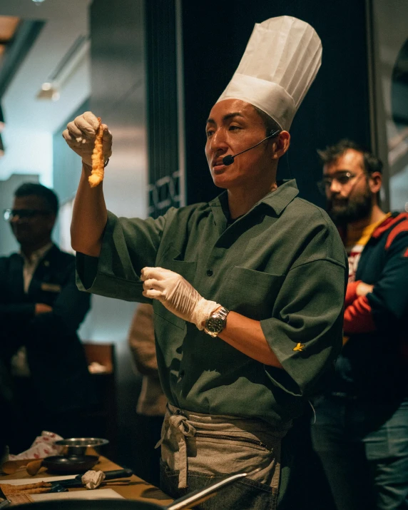 a man that is standing with food in his hand