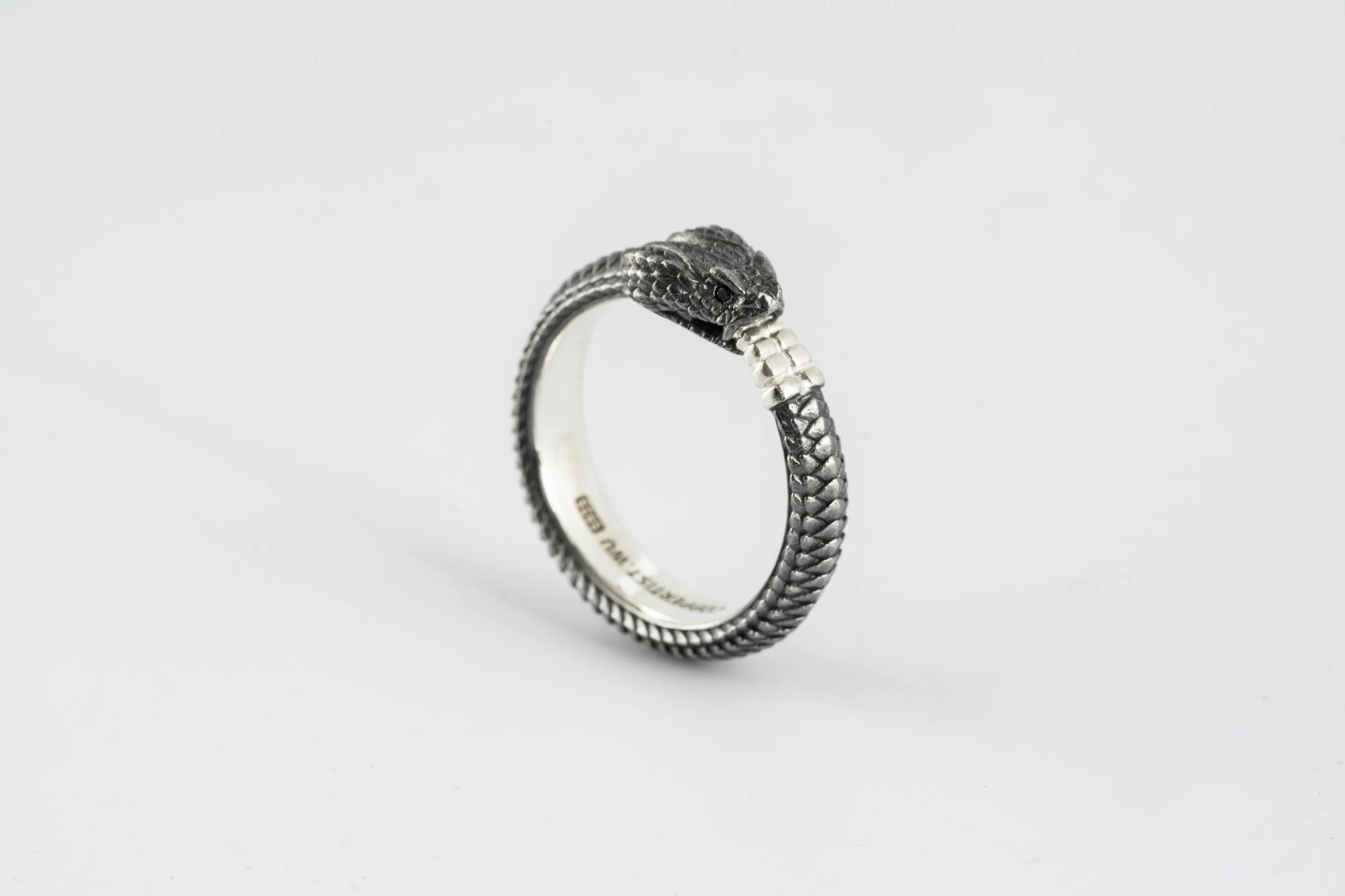 a ring with a large snake on the side of it