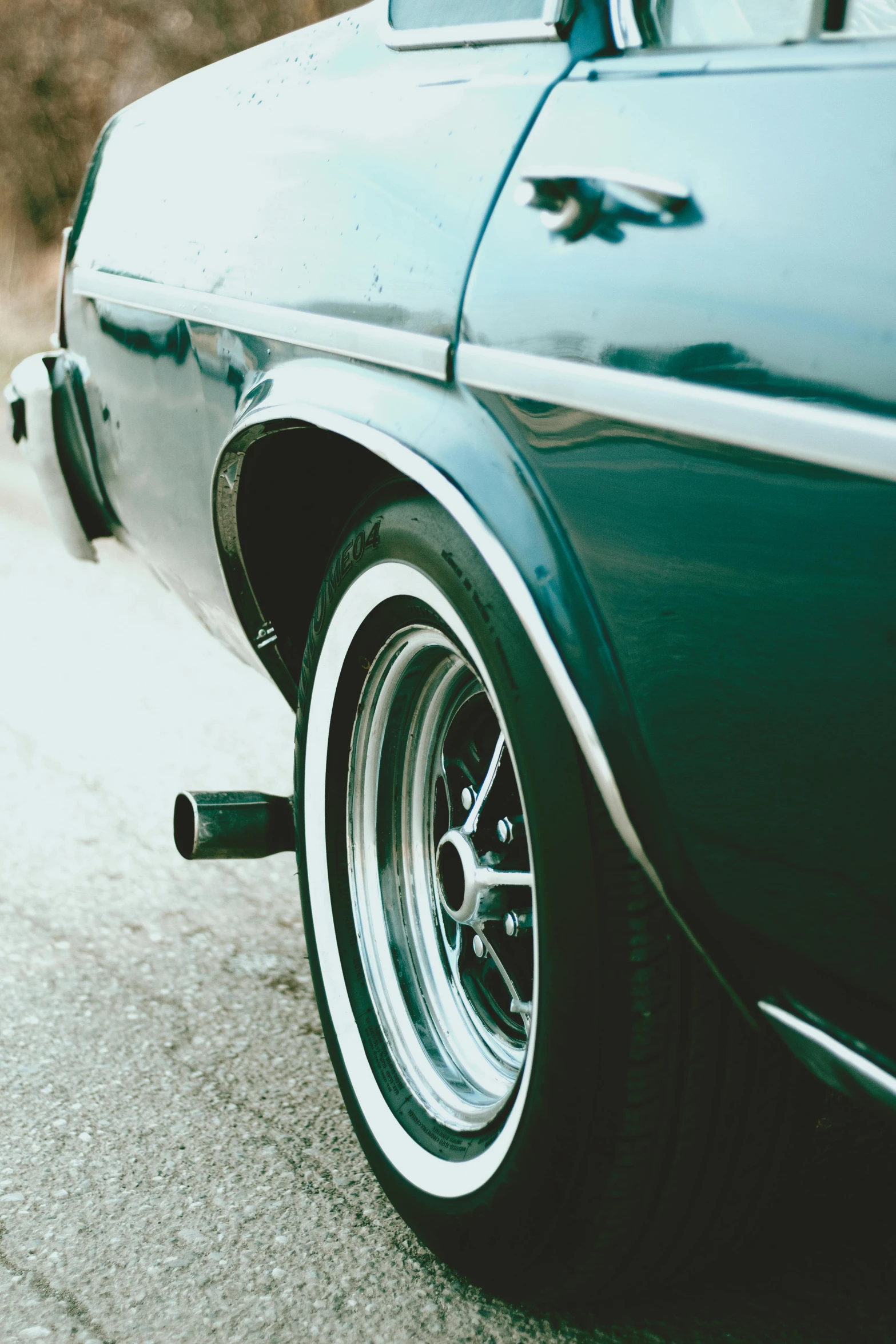 an old car parked on the side of the street