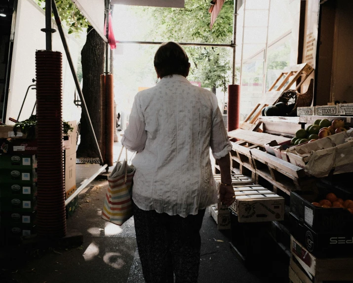 an image of a woman walking into the back of a building