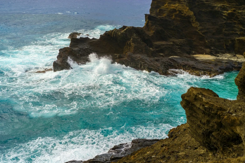 the water is blue and strong as it's foaming up