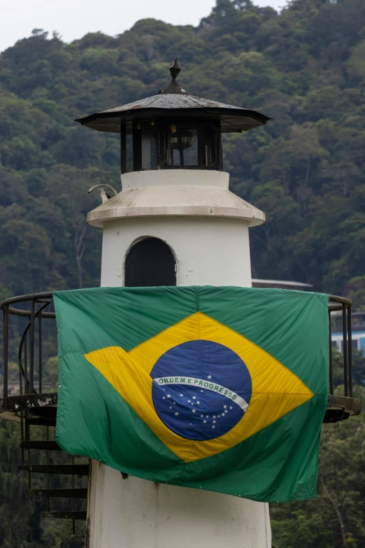 an image of a flag with a bell tower in the background