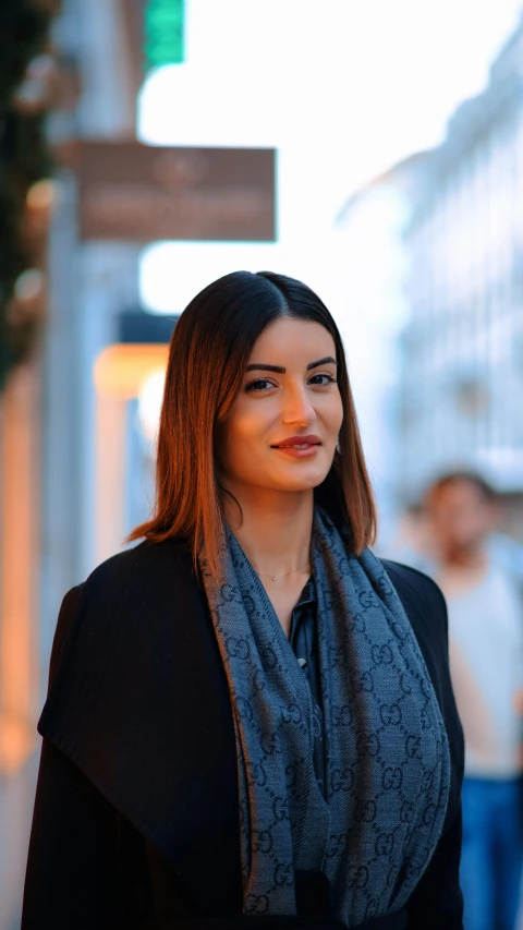 woman on a street with a scarf on