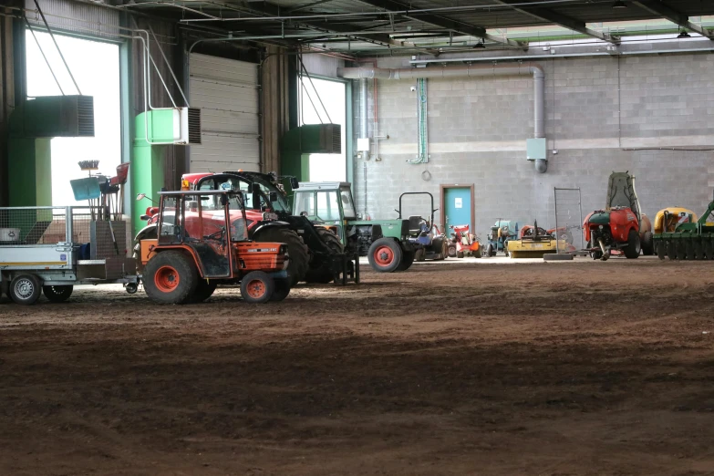 a group of tractors is in the dirt