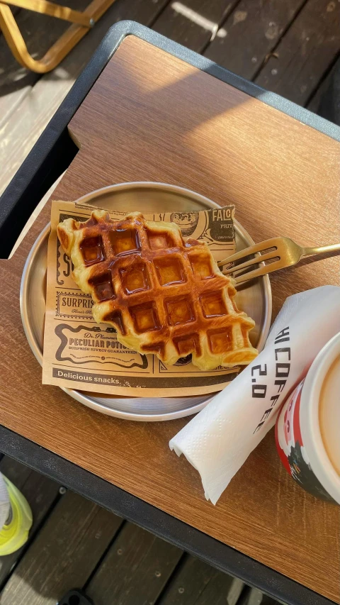 a plate filled with waffles sitting on top of a table