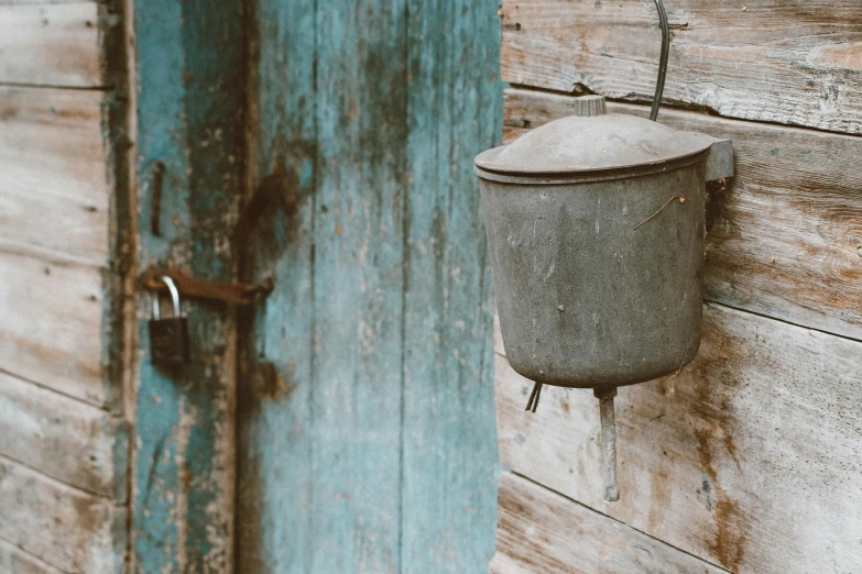 a cup attached to a door and a key