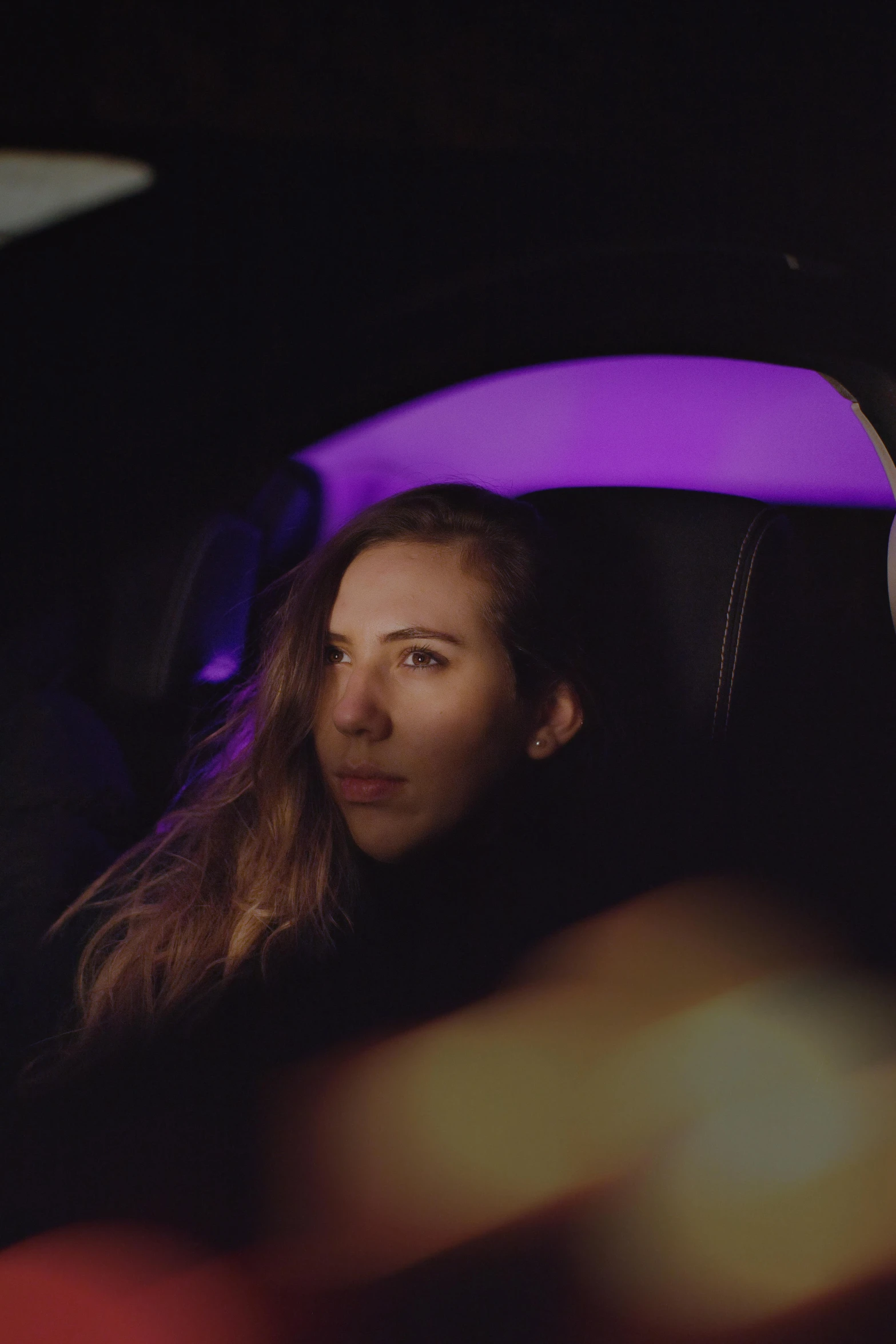 a person sits in the car with an umbrella