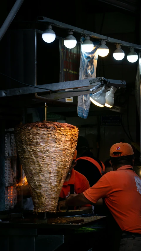 some men are preparing items inside the dark