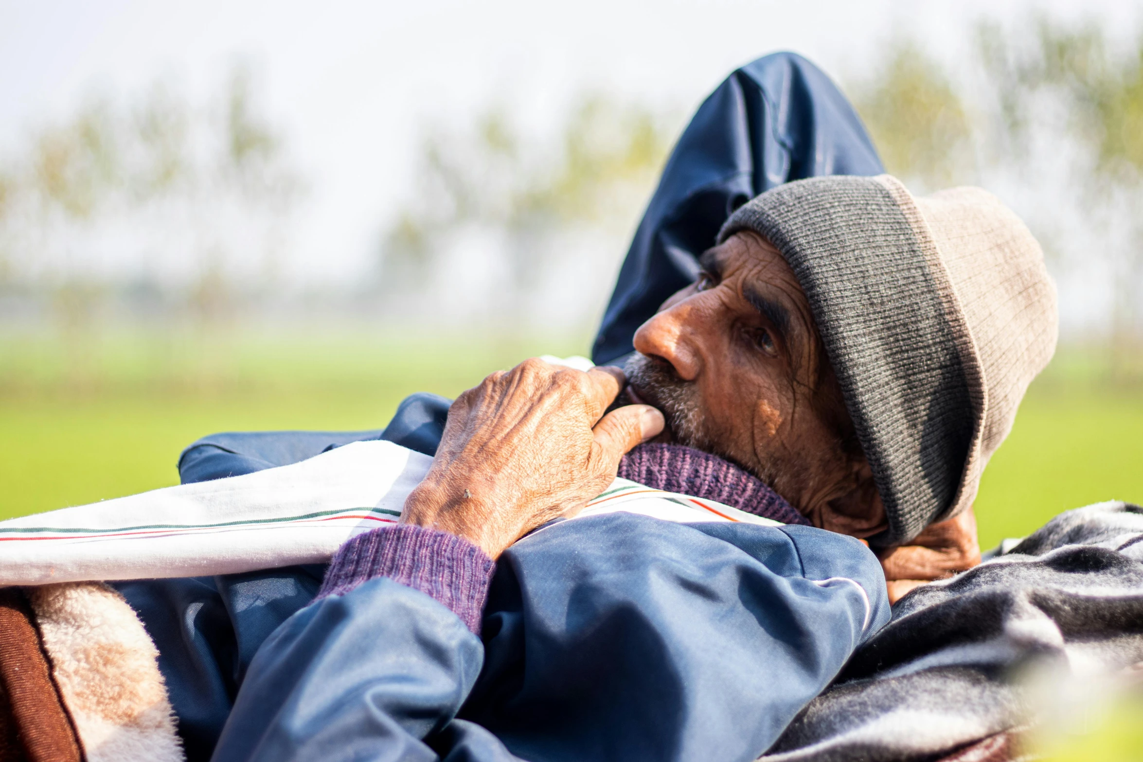 a person with their head resting on a towel