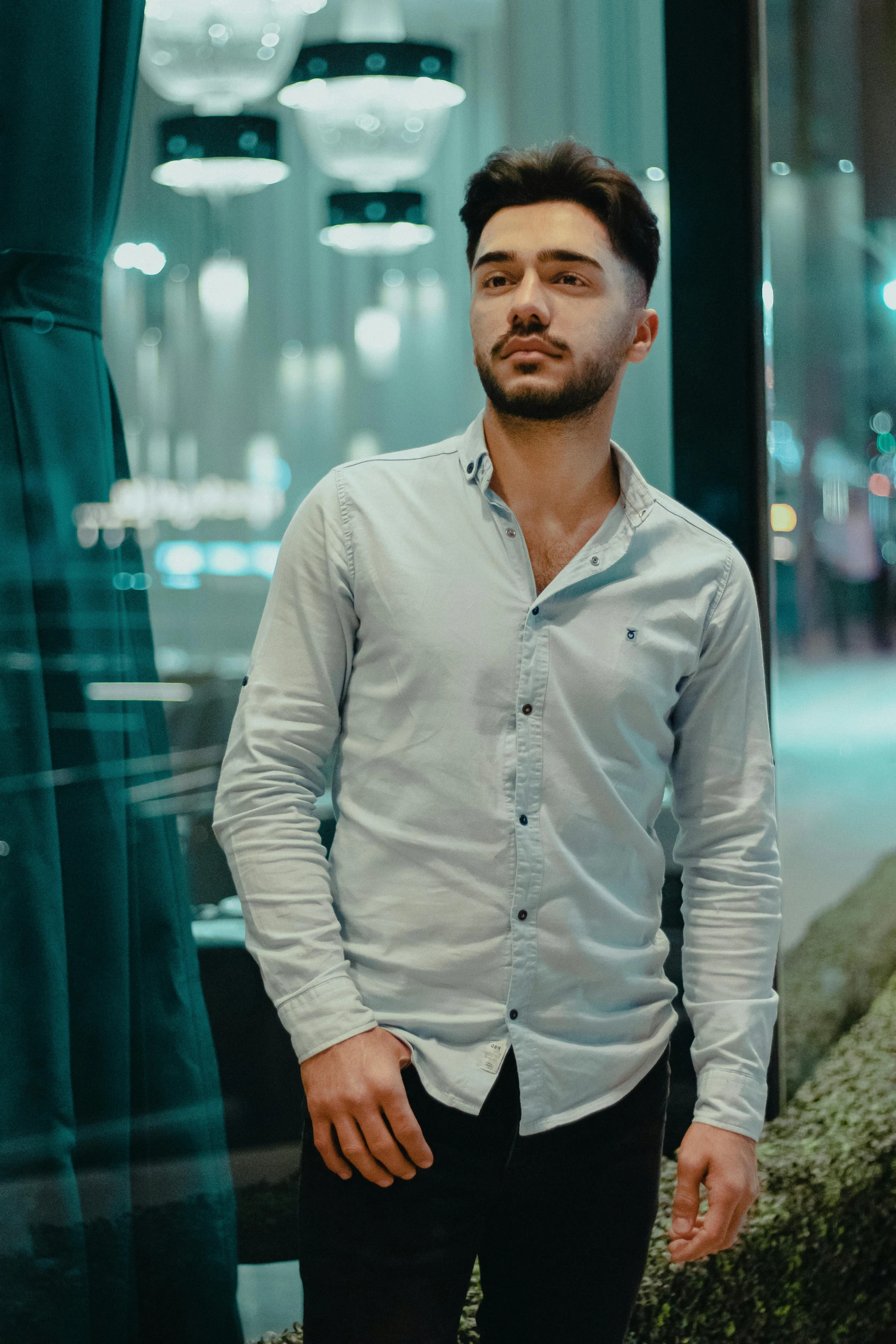 a man is standing outside near a building