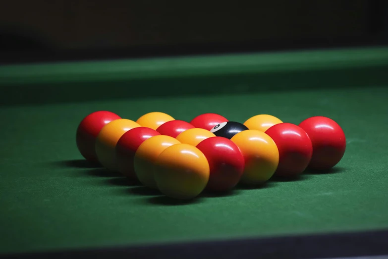 a row of billards arranged on top of a pool table